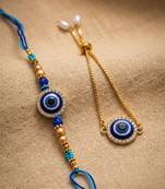 set of 2 blue evil eye gold toned bhaiya bhabhi rakhi with roli chawal chandan mishri