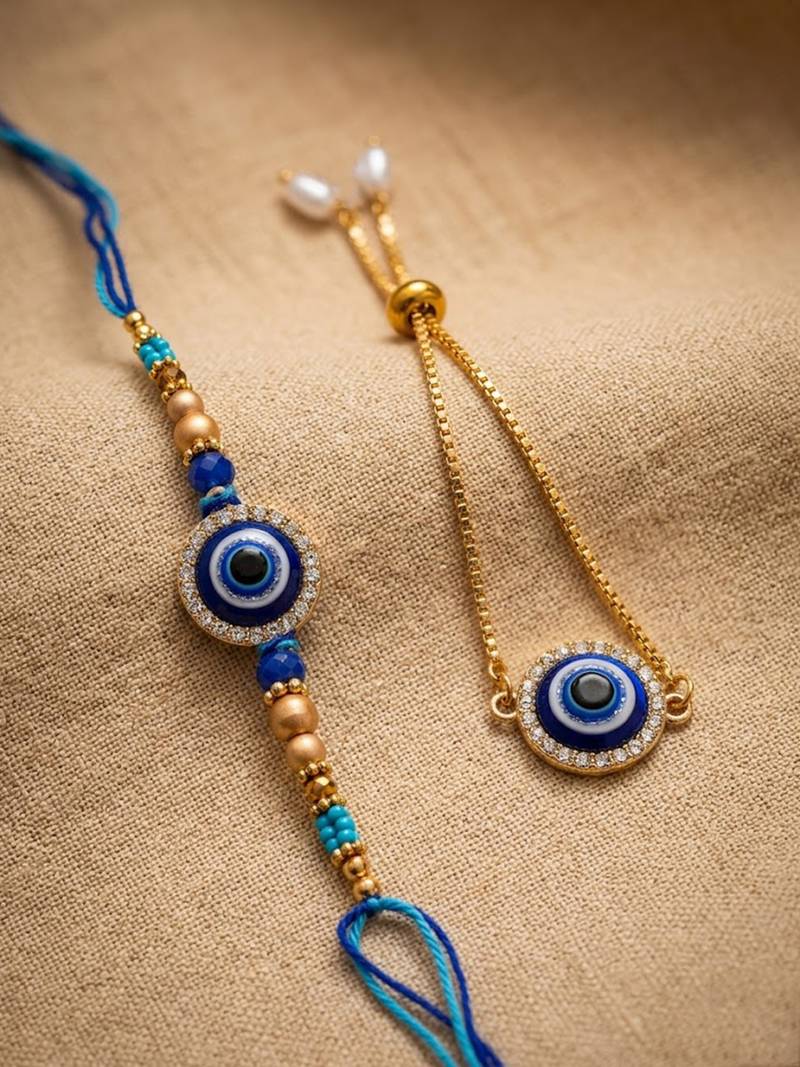 set of 2 blue evil eye gold toned bhaiya bhabhi rakhi with roli chawal chandan mishri