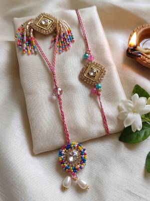 set of 2 white artificial stones golden toned bhaiya bhabhi rakhi with roli chawal 1