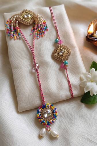 set of 2 white artificial stones golden toned bhaiya bhabhi rakhi with roli chawal