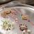 set of 2 white artificial stones golden toned bhaiya bhabhi rakhi with roli chawal