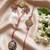set of 2 white artificial stones golden toned bhaiya bhabhi rakhi with roli chawal