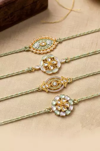 set of 4 white artificial stones & green thread rakhi with roli chawal chandan mishri