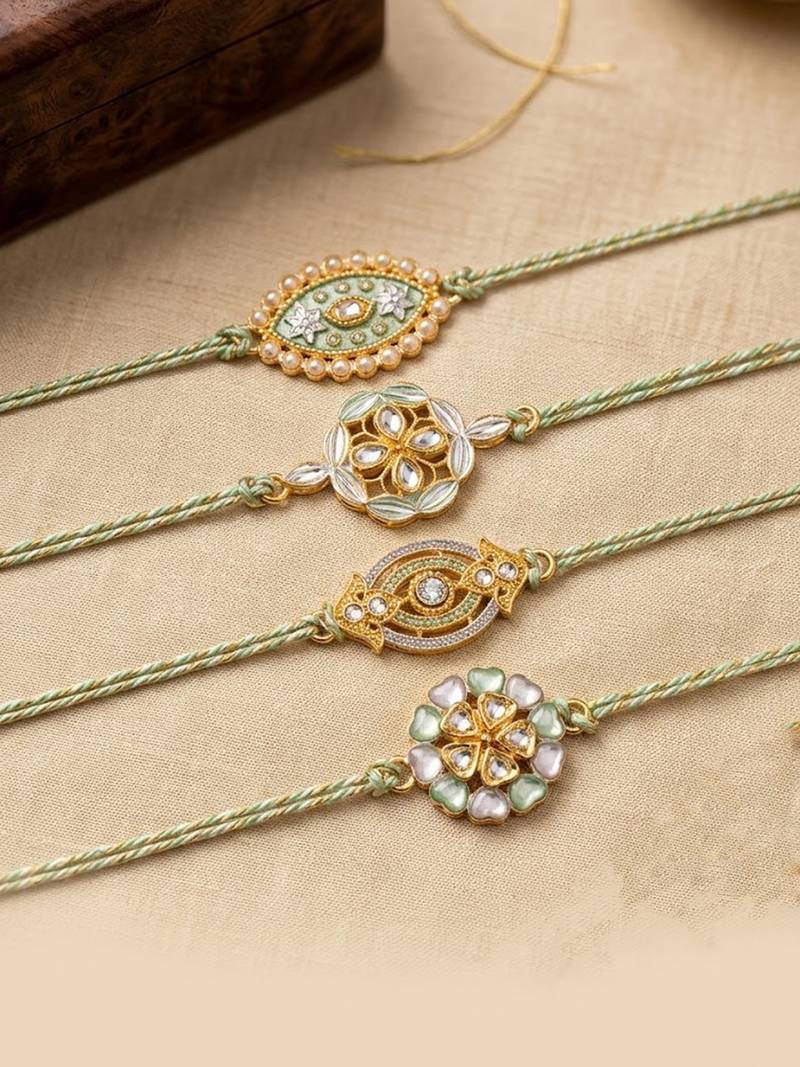 set of 4 white artificial stones & green thread rakhi with roli chawal chandan mishri
