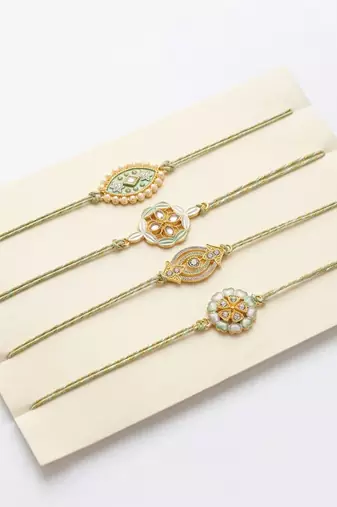 set of 4 white artificial stones & green thread rakhi with roli chawal chandan mishri