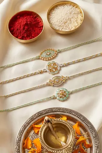 set of 4 white artificial stones & green thread rakhi with roli chawal chandan mishri