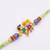 kids multicolor artificial beads thread rakhi with roli chawal chandan chandan mishri
