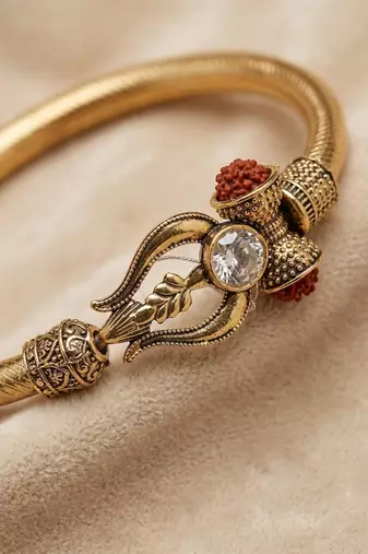 gold plated trishool design rudraksh rakhi bracelet with roli chawal chandan mishri