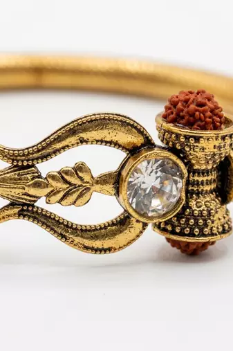 gold plated trishool design rudraksh rakhi bracelet with roli chawal chandan mishri