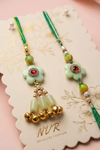 set of 2 flower shape artificial stones & beads bhaiya bhabhi rakhi with roli chawal