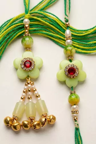 set of 2 flower shape artificial stones & beads bhaiya bhabhi rakhi with roli chawal