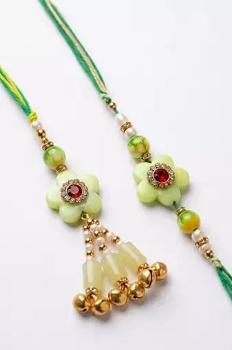 set of 2 flower shape artificial stones & beads bhaiya bhabhi rakhi with roli chawal