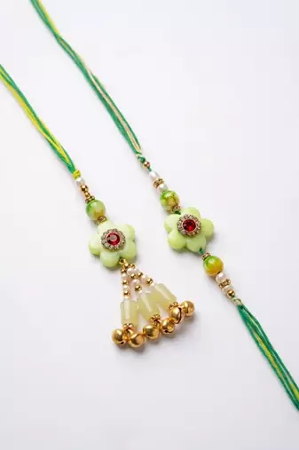 set of 2 flower shape artificial stones & beads bhaiya bhabhi rakhi with roli chawal