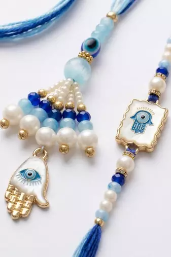 set of 2 evil eye hand design bhaiya bhabhi rakhi with roli chawal chandan mishri