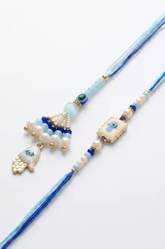 set of 2 evil eye hand design bhaiya bhabhi rakhi with roli chawal chandan mishri