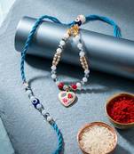 set of 2 evil eye beaded gold toned bhaiya bhabhi rakhi with roli chawal chandan