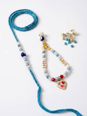 set of 2 evil eye beaded gold toned bhaiya bhabhi rakhi with roli chawal chandan 3