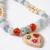 set of 2 evil eye beaded gold toned bhaiya bhabhi rakhi with roli chawal chandan