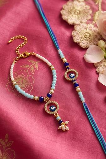 set of 2 blue evil eye gold toned beaded bhaiya bhabhi rakhi with roli chawal chandan