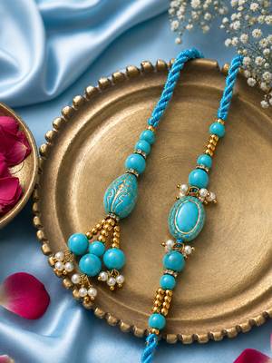 set of 2 turquoise blue artificial beads bhaiya bhabhi rakhi with roli chawal chandan 1
