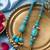 set of 2 turquoise blue artificial beads bhaiya bhabhi rakhi with roli chawal chandan