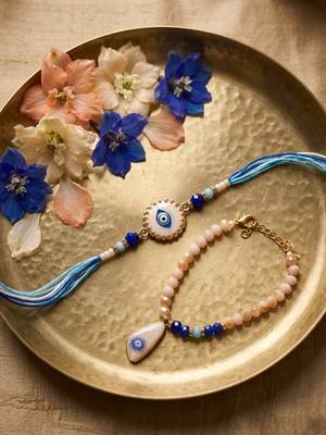 set of 2 gold toned evil eye beaded bhaiya bhabhi rakhi with roli chawal chandan 2