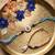 set of 2 gold toned evil eye beaded bhaiya bhabhi rakhi with roli chawal chandan