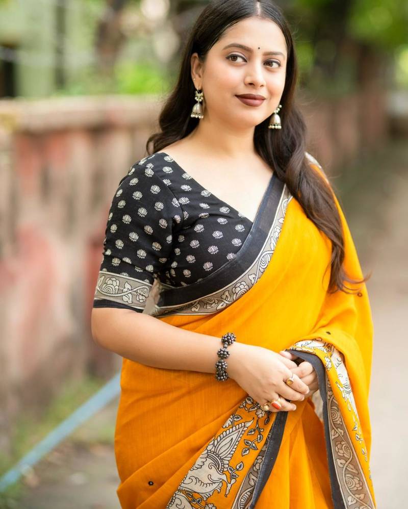 yellow art silk woven saree with floral print