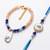 set of 2 gold toned evil eye beaded bhaiya bhabhi rakhi with roli chawal chandan
