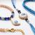 set of 2 gold toned evil eye beaded bhaiya bhabhi rakhi with roli chawal chandan