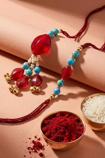 set of 2 artificial beads & gold toned ghungroo bhaiya bhabhi rakhi with roli chawal