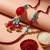 set of 2 artificial beads & gold toned ghungroo bhaiya bhabhi rakhi with roli chawal