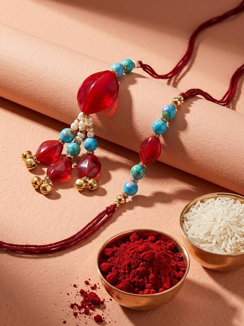 set of 2 artificial beads & gold toned ghungroo bhaiya bhabhi rakhi with roli chawal