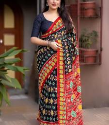 black linen printed saree with ikkat print