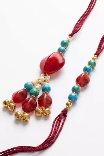 set of 2 artificial beads & gold toned ghungroo bhaiya bhabhi rakhi with roli chawal