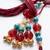 set of 2 artificial beads & gold toned ghungroo bhaiya bhabhi rakhi with roli chawal
