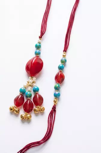 set of 2 artificial beads & gold toned ghungroo bhaiya bhabhi rakhi with roli chawal