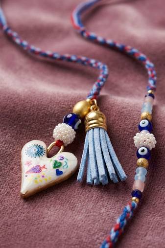 set of 2 evil eye beaded heart shape bhaiya bhabhi rakhi with roli chawal chandan