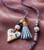 set of 2 evil eye beaded heart shape bhaiya bhabhi rakhi with roli chawal chandan