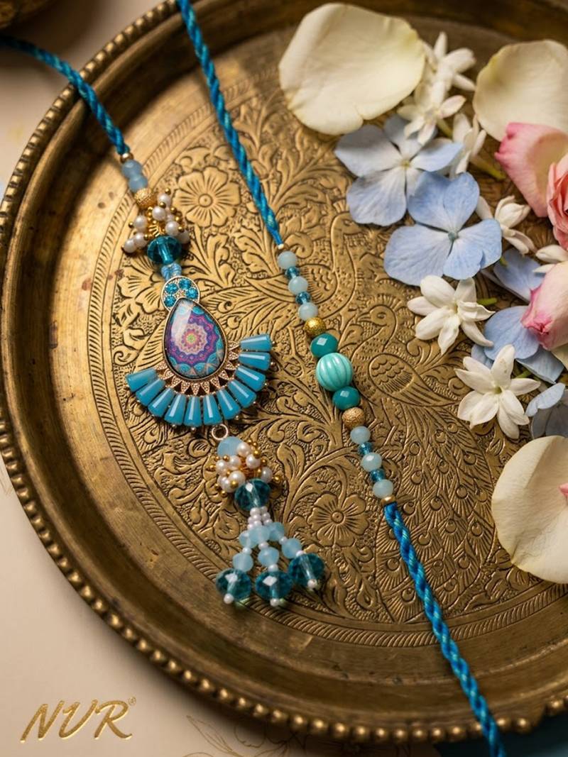 set of 2 transparent beads pear shape bhaiya bhabhi rakhi with roli chawal chandan