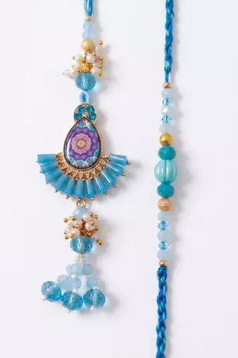 set of 2 transparent beads pear shape bhaiya bhabhi rakhi with roli chawal chandan
