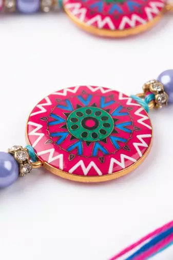 set of 2 artificial stones & beads floral design bhaiya bhabhi rakhi with roli chawal