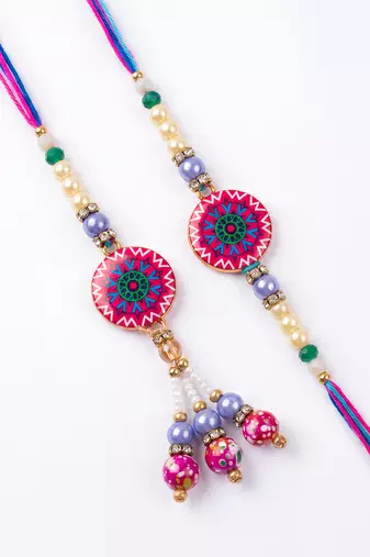 set of 2 artificial stones & beads floral design bhaiya bhabhi rakhi with roli chawal