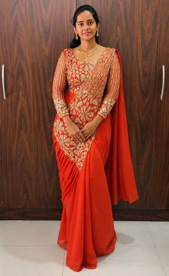 Orange georgette embroidered saree with beads 1