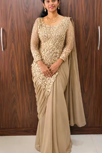 Beige georgette embroidered saree with beads