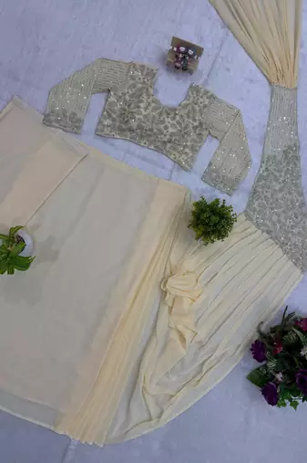 Beige georgette embroidered saree with beads