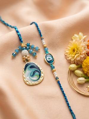 set of 2 blue evil eye traditional gold toned bhaiya bhabhi rakhi with roli chawal 1
