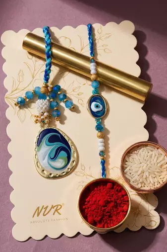 set of 2 blue evil eye traditional gold toned bhaiya bhabhi rakhi with roli chawal