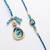 set of 2 blue evil eye traditional gold toned bhaiya bhabhi rakhi with roli chawal