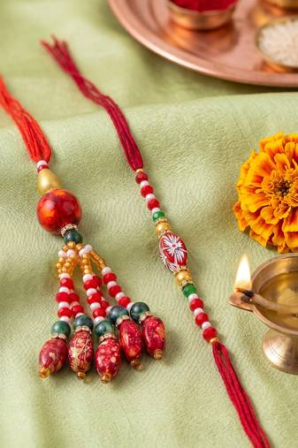 set of 2 designer red artificial beads bhaiya bhabhi rakhi with roli chawal chandan